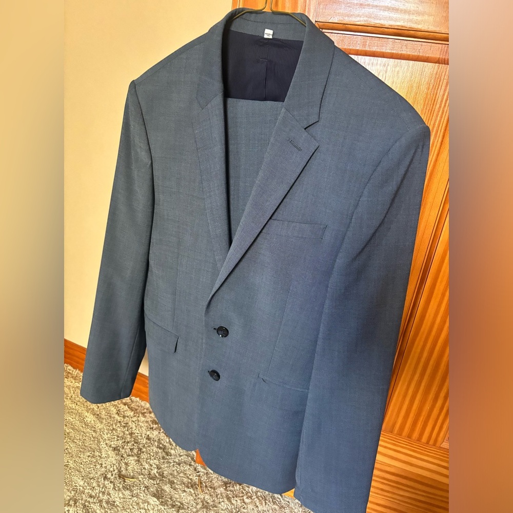 Two piece suit by Express. Extra slim in light blue color. Pants size 28/30